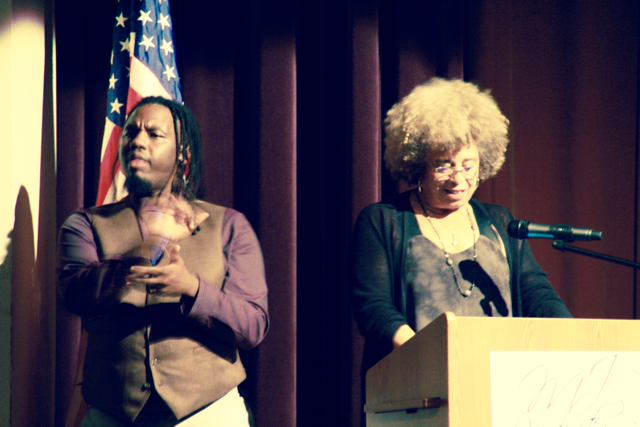 Angela Davis with sign language interpreter Christopher Coles